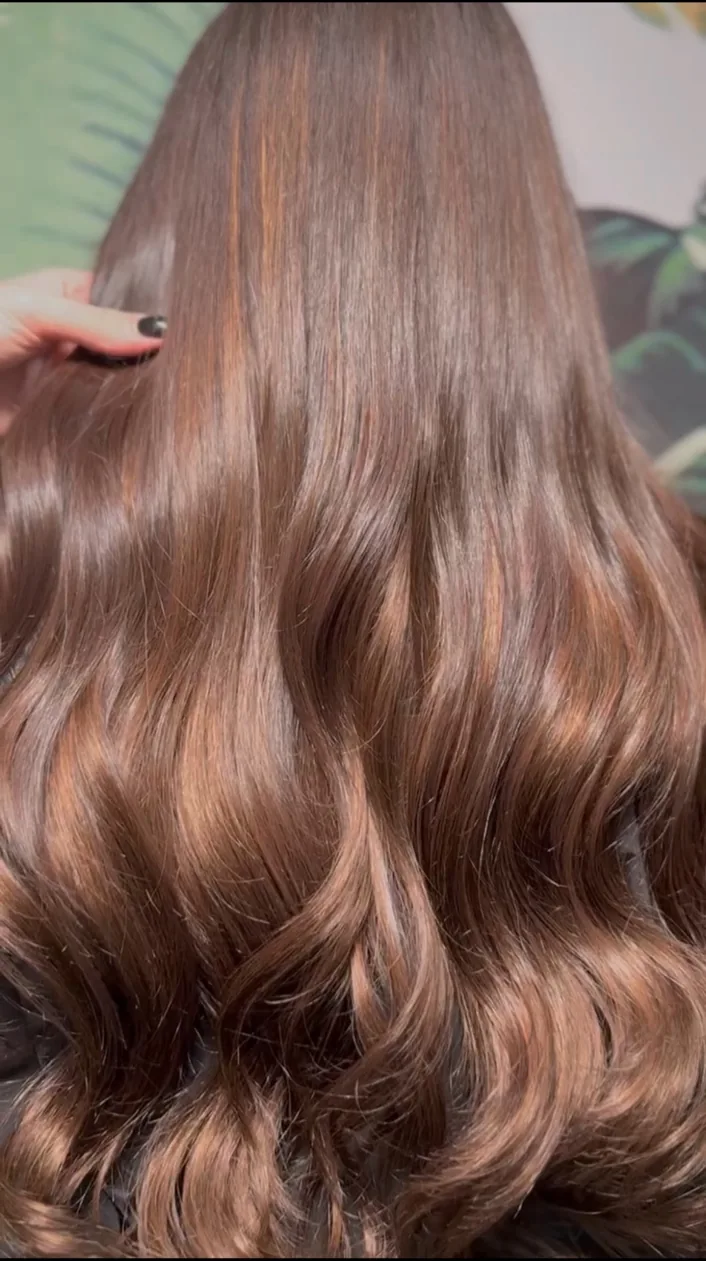 Warm copper-toned hair with soft movement